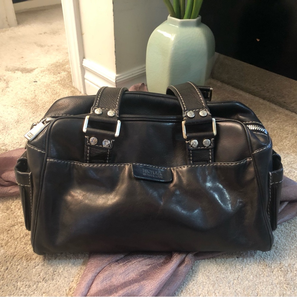 Michael Kors Black Leather handbag.  Lots of pockets for anything/everything